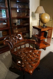 A early 20th Century English Brown Revolving Desk Chair on the original castors  and having a very comfortable reclining action. .