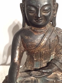 A 17th Century Cast Bronz Sculpture Of A Buddha with Traces of Lacquer and Gilding. Thebethian.