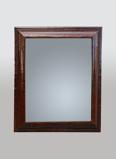 A 17th Century William and Mary Figured Walnut Cushion Mirror.