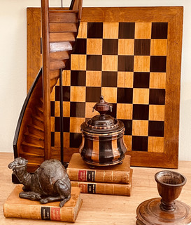 A 19th Century Chess Board with nice Marquetry. An 18th Century Tobacco Jar. An English Miniature Model of a Stair Case. A 19th Century Bronze Coconut Inkwell in the form of a Camel.