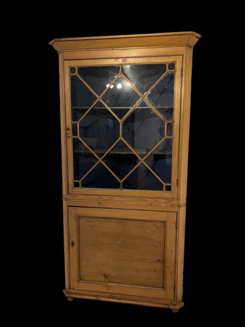 A 19th Century English Pine Corner Cabinet with Astragal Glazed Door.