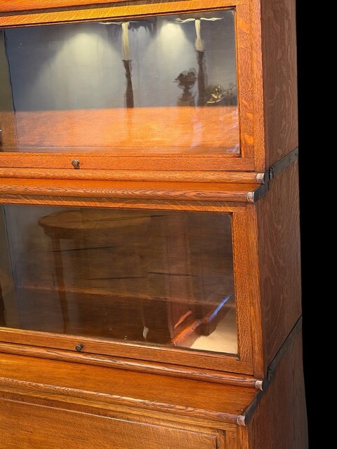 A 19th Century English Waterfall Globe Wernicke Oak Bookcase with Cupboard Base
