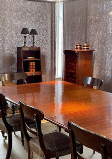 A 19th Century Mahogany Dining Table. A Regency Bookcases. A 19th Century Burr Walnut Wellington Chest.