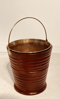 A 19th Century Walnut Kettle Warmer / Jardinière having the original Brass Liner and Coppered Bucked.
