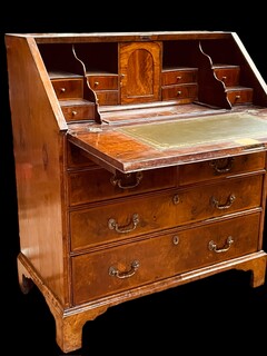 A Beautiful English 18th Century Burr Walnut Bureau having a Stepped Interior and Green Leather.