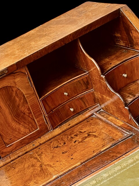 A Beautiful English 18th Century Burr Walnut Bureau having a Stepped Interior and Green Leather.