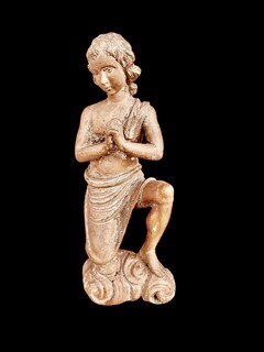 A Carved Wooden Kneeling Angel ( Putto ) . Southern Europe, Circa 18th Century.