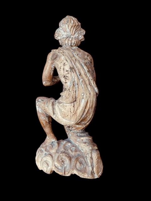 A Carved Wooden Kneeling Angel ( Putto ) . Southern Europe, Circa 18th Century.