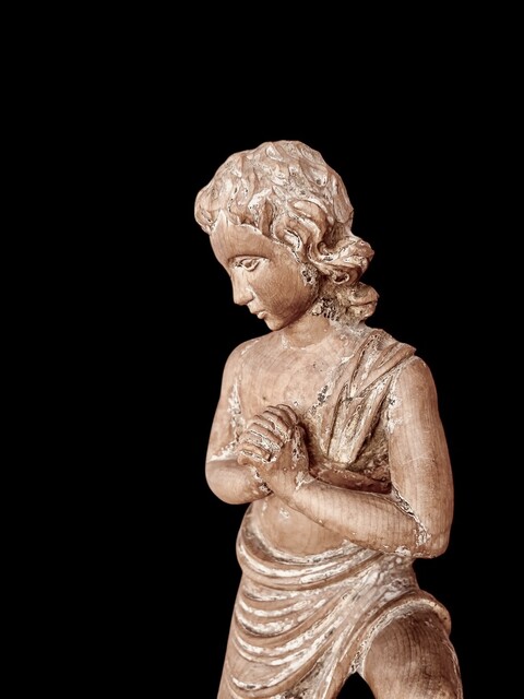 A Carved Wooden Kneeling Angel ( Putto ) . Southern Europe. Circa 18th Century.