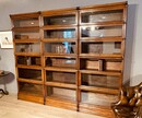 A English Set of three Oak ' Globe Wernicke ' Bookcases. Six Sections high.