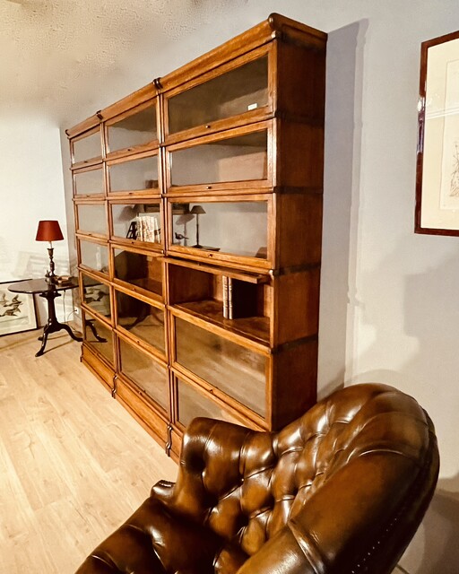 A English Set of three Oak ' Globe Wernicke ' Bookcases. Six Sections high.