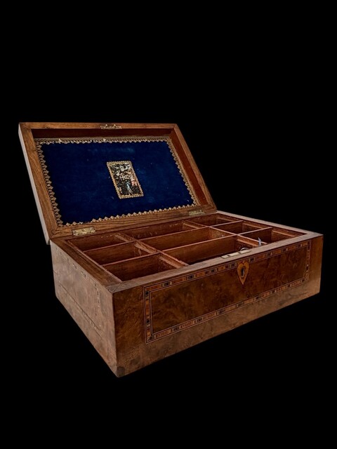 A Victorian English Trinity House Box in burr walnut with maritime marquetry, geometric parquetry borders and a fitted interior, dating from the mid 19th century.