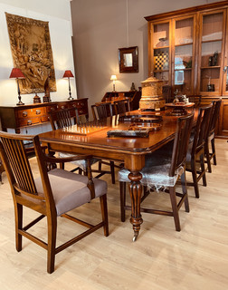 A Wiliam IV Mahogany Extending Dining Table. Eight 18th Century Dining Chairs. An 18th Century Oak Low Dresser. A 19th Century Victorian Bookcase.