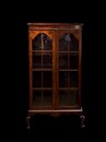 An Antique English Edwardian Burr Walnut Glazed Bookcase