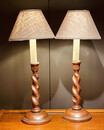 An Antique Pair of English Oak Lamp Stands.