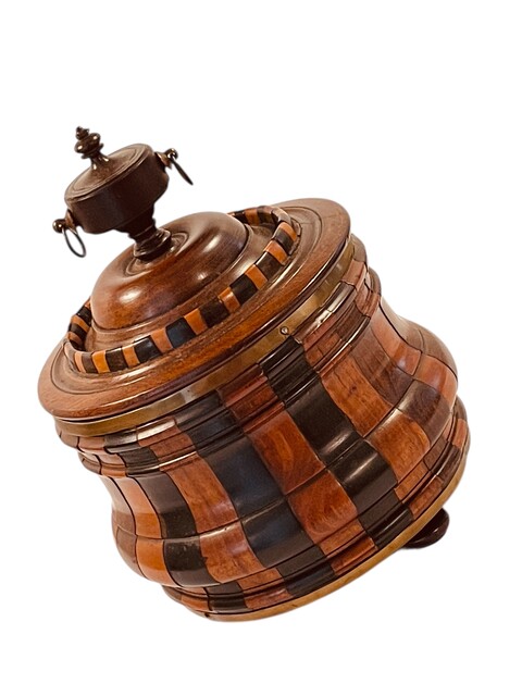 An Early 19th Century Tobacco Jar. Stave construction in Walnut, Ebony and Boxwood. Ca 1800.