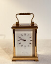 An Early 20th Century Four Glass Brass Carriage Clock with key. Shortland & Bowen