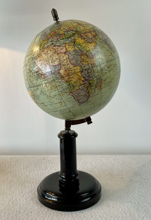 An End 19th Century Terrestrial Globe on a Ebonised Stand. G. Thomas, Rue N.D. Des  Champs. Paris.