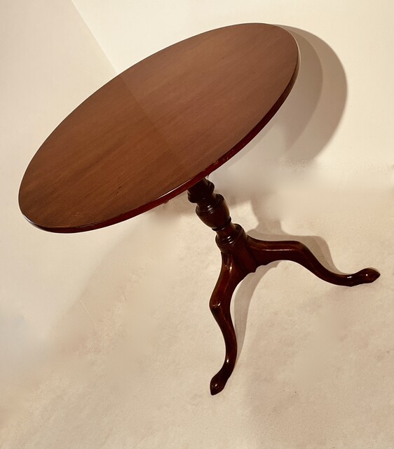 An English 18th Century Georgian Mahogany Tilt Top Table on a Tripod Base.