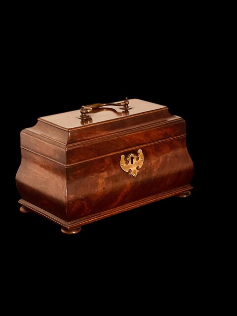 An English 18th Century Mahogany Bombe Tea Caddy on turned Bun Feet. George III.