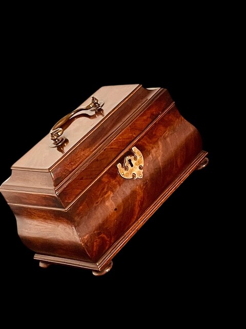 An English 18th Century Mahogany Bombe Tea Caddy on turned Bun Feet. George III.