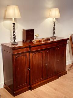 An English 19th Century Mahogany Breakfront Side Board having one Drawer.