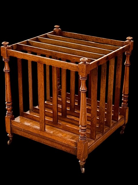 An English 19th Century Mahogany Canterbury on castors.