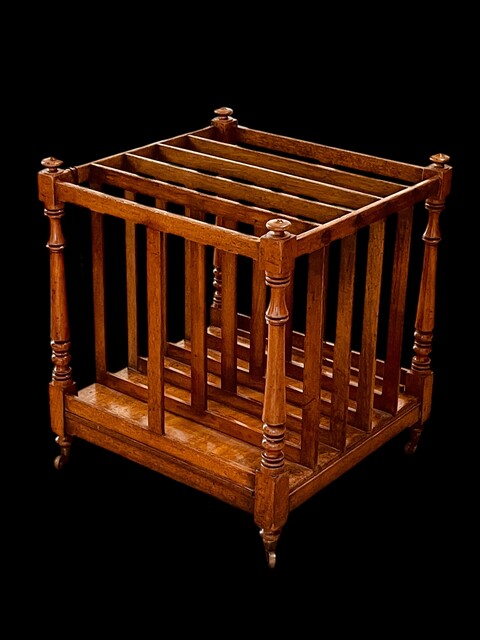 An English 19th Century Mahogany Canterbury on castors.