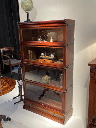 An English 19th Century Mahogany Globe Wernicke Bookcase. Four Sections High.