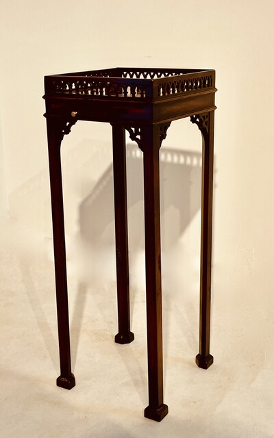 An English 19th Century Mahogany Kettle Stand with a Square Top and open-free Gallery.