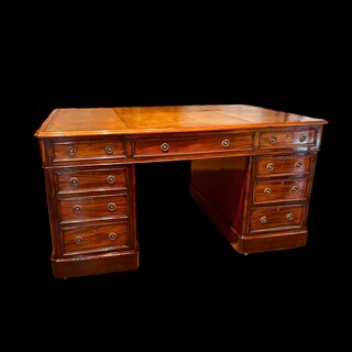 An English 19th Century Mahogany Partners Desk having a Beautiful Green Old Leather.