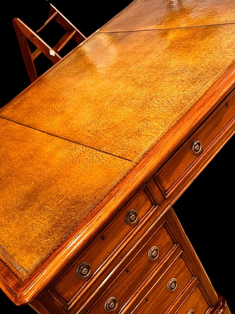 An English 19th Century Mahogany Partners Desk having a Beautiful Green Old Leather.