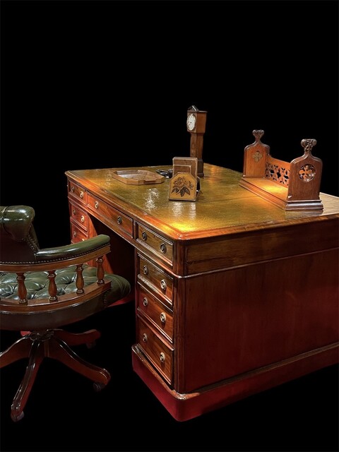An English 19th Century Mahogany Partners Desk having a beautiful Old Leather.