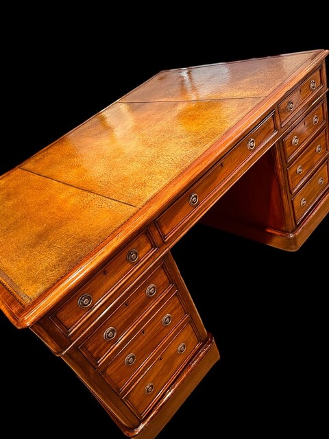 An English 19th Century Mahogany Partners Desk having a beautiful Old Leather.