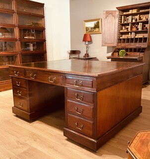 An English 19th Century Mahogany Partner's Desk having Drawers on Both Sides.