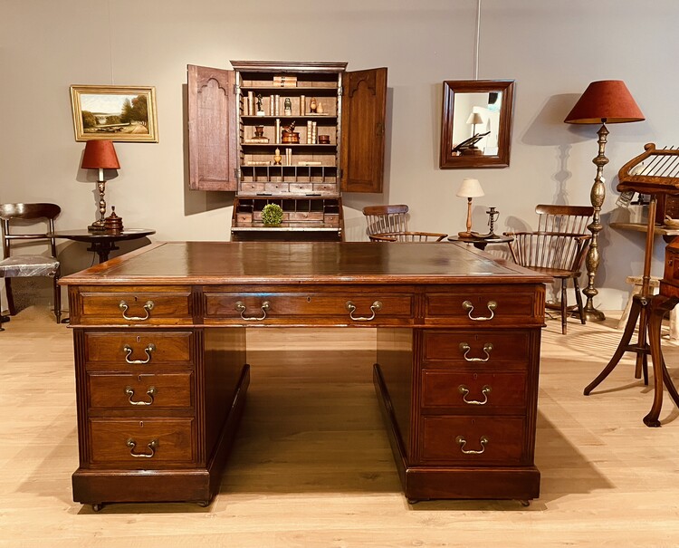 An English 19th Century Mahogany Partner's Desk having Drawers on Both Sides.