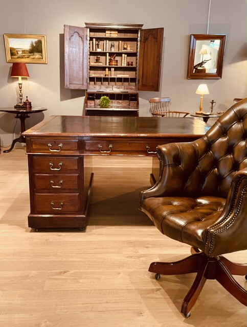 An English 19th Century Mahogany Partner's Desk having Drawers on Both Sides.