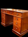 An English 19th Century Mahogany Pedestal Desk having a beautiful green Leather.