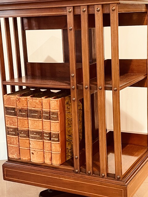 An English 19th. Century mahogany Revolving Bookcase having a Cast Iron Base.
