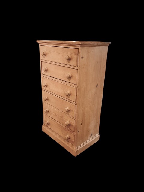 An English 19th Century Pine Wellington Chest having six graduated Drawers.