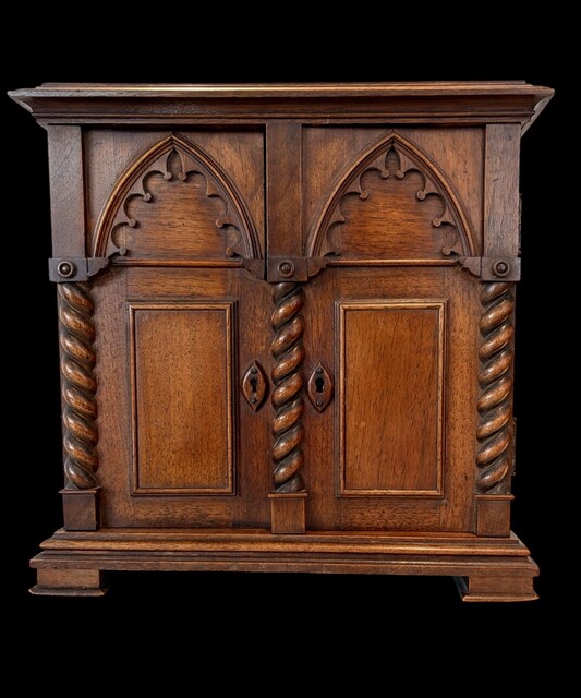 An English 19th Century Walnut Neo-Gothic Apprentice Piece Cabinet.