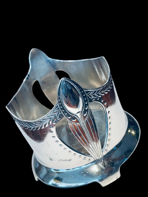 An English Art Nouveau Silver Plated Bottle Holder.