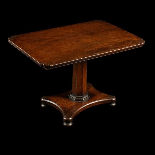 An English early 19th century apprentice mahogany tilt top table with an octagonal pedestal, platform base and rich original patina. A finely made miniature cabinetmaker's apprentice piece.