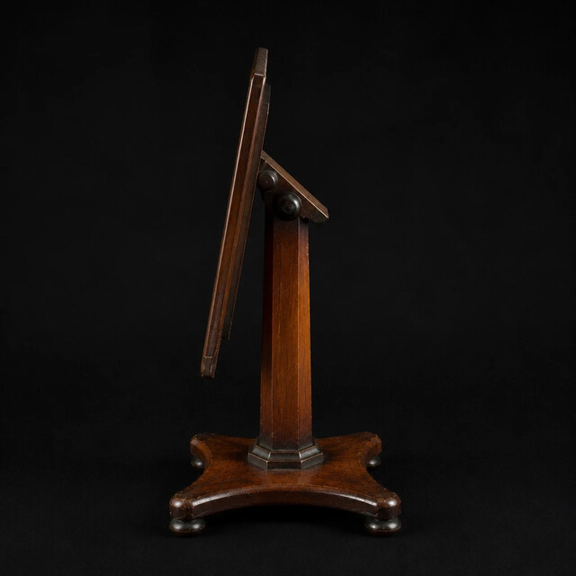 An English early 19th century apprentice mahogany tilt top table with an octagonal pedestal, platform base and rich original patina. A finely made miniature cabinetmaker's apprentice piece.