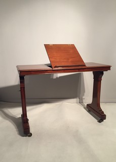 An English Early 19th Century Mahogany Reading and Writing Stand on Castors and Adjustable in Hight.