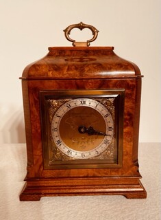 An English Early 20th Century Burr Walnut Eight Day Elliott Clock. Signed ' Garrard & Co Let, 112 Regent Street, London.