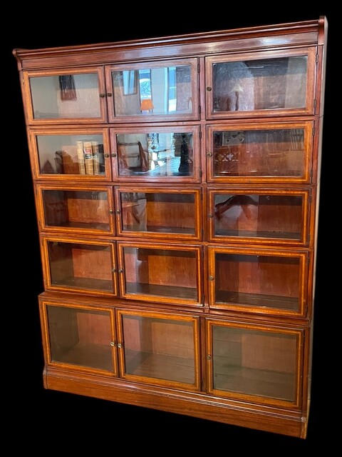 An English Early 20th Century mahogany sectional Bookcase by Minty of Oxford.