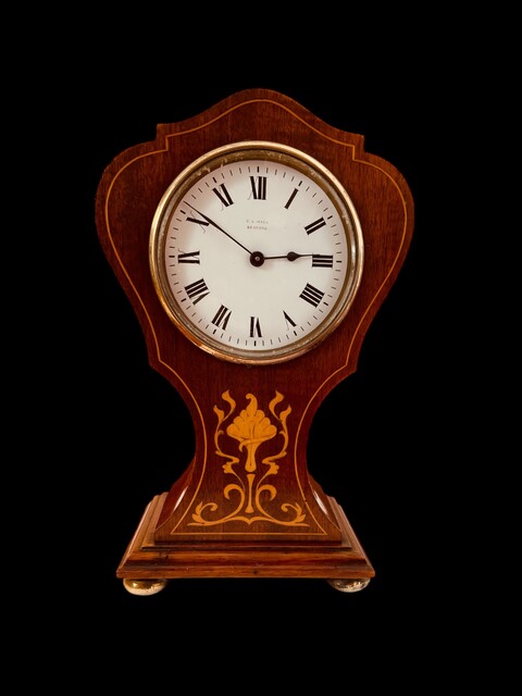 An English Edwardian Mahogany 8-Day Clock with Satinwood Inlay.