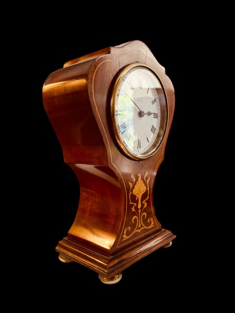 An English Edwardian Mahogany 8-Day Clock with Satinwood Inlay.