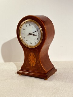 An English Edwardian Mahogany Balloon Mantel Clock having a Satinwood Inlay